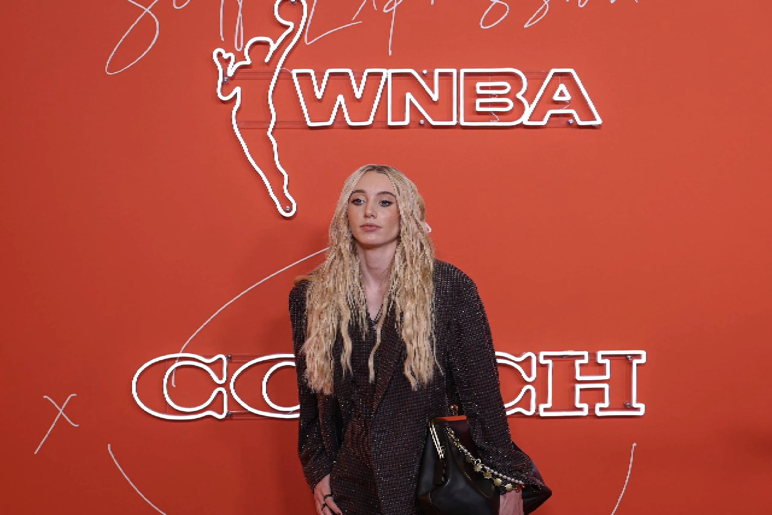 Paige Bueckers on 2025 WNBA Draft orange carpet.